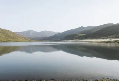 Serene Alpine Lake Reflection (AI-generated)