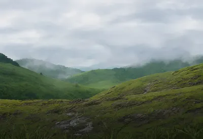 Misty Green Hills and Cloudy Mountain Landscape (AI-generated)