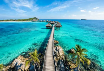 Tropical Overwater Bungalows with Turquoise Sea (AI-generated)