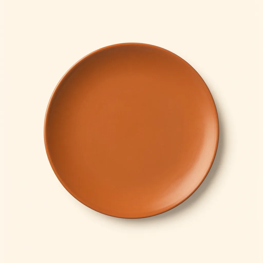 Round terracotta ceramic plate viewed from above on a plain beige background. (AI-generated)