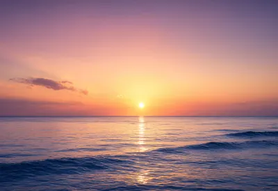 Golden Sunset Reflecting on a Calm Ocean (AI-generated)