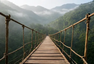 Wooden Suspension Bridge in Misty Mountain Forest (AI-generated)