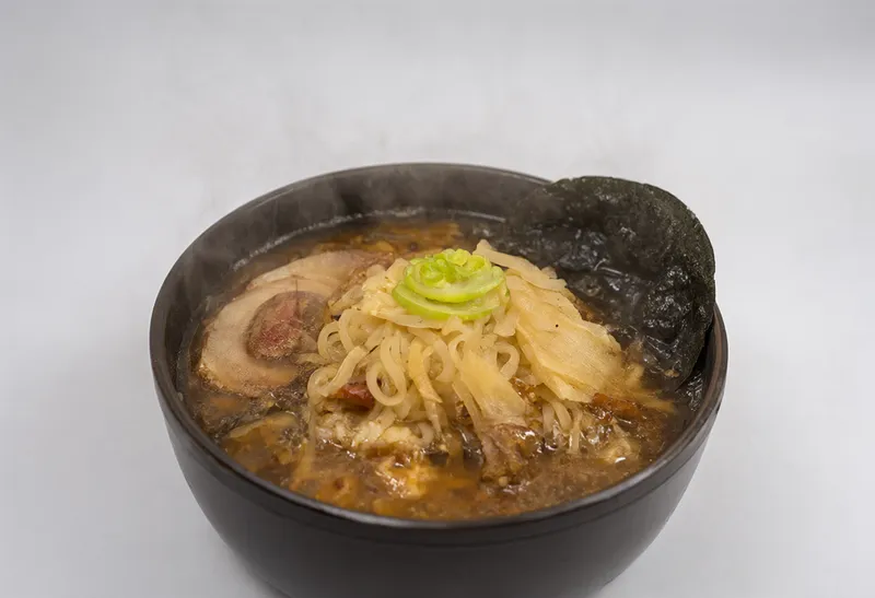 Minimalist studio photo of a ramen bowl (AI-generated)