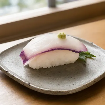 Tender Octopus Nigiri Sushi on a Ceramic Plate (AI-generated)