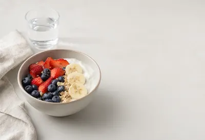 Healthy Yogurt Breakfast Bowl with Fresh Berries and Banana (AI-generated)