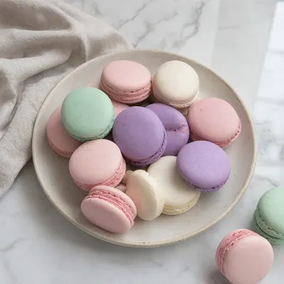 Pastel French Macarons on a Ceramic Plate (AI-generated)