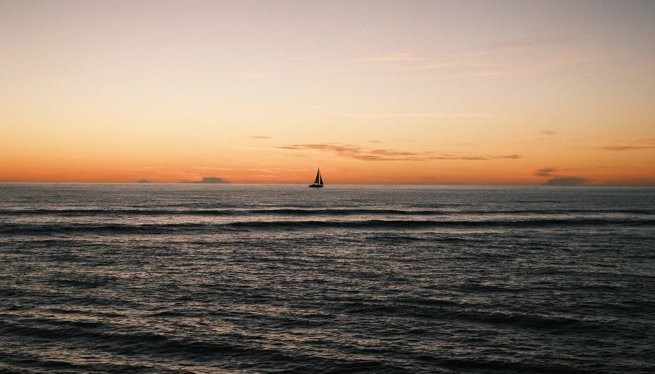 Silhouette of a sailboat on a calm ocean at sunset (AI-generated)