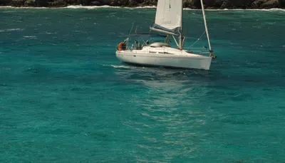 White Sailboat on Turquoise Water (AI-generated)