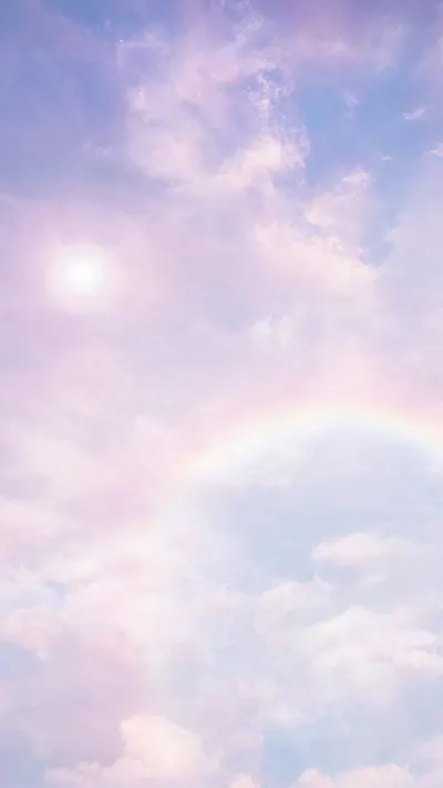 Pastel Cloudy Sky with Sun Flare