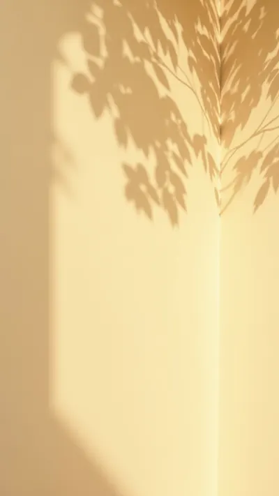 Warm Beige Wall with a Shadow of Leaves