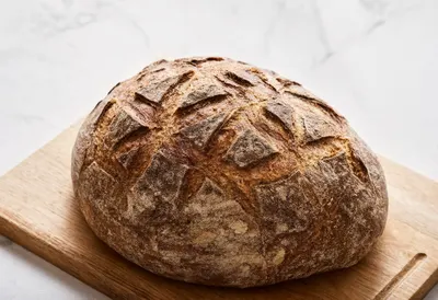 Sourdough Loaf on a Rustic Board