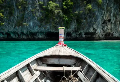 Longtail Boat on Turquoise Water