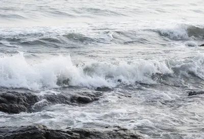 Ocean Waves on Dark Rocks