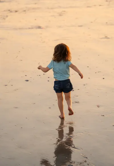 Child Running on a Beach
