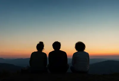 Friends Silhouetted Against a Colorful Twilight Sky