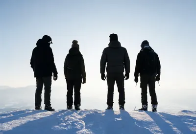 Group of Four on a Snowy Ridge