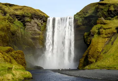 Waterfall In A Green Gorge in winter