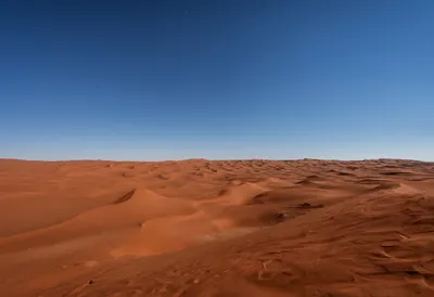 Red Sand Desert Dunes under a starry sky