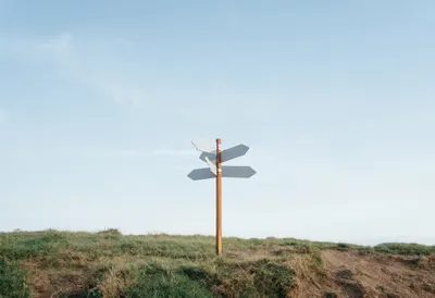 Signpost With Blank Arrows On A Hilltop on a quiet day
