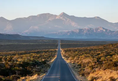 Long Straight Road Toward Distant Mountains from above