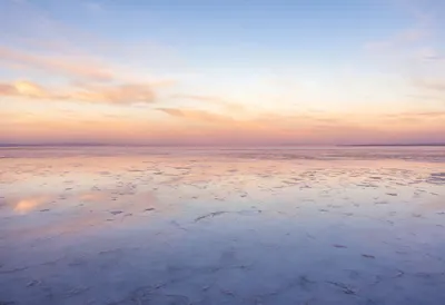 Salt Flats Reflecting A Pastel Sky in warm evening light