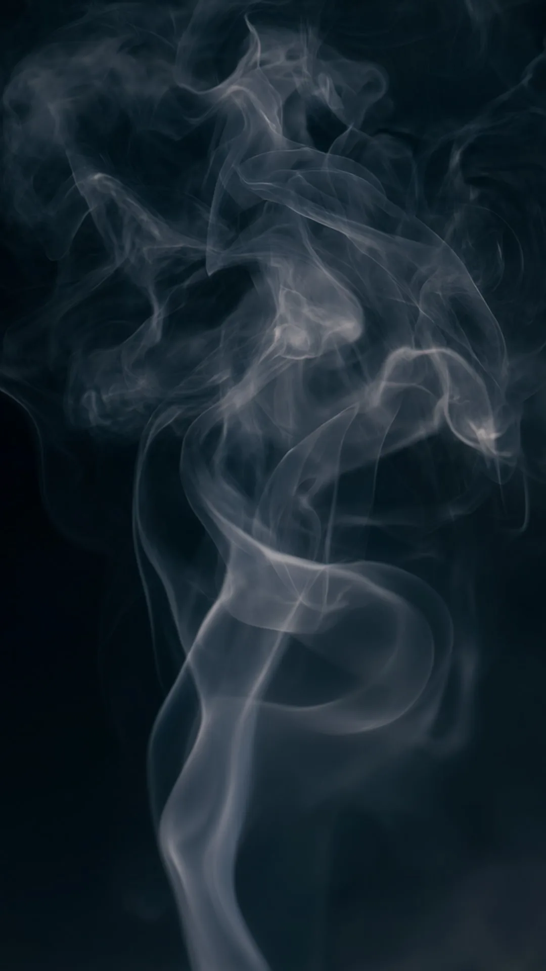 Soft Smoke Wisps On A Dark Background in a soft palette