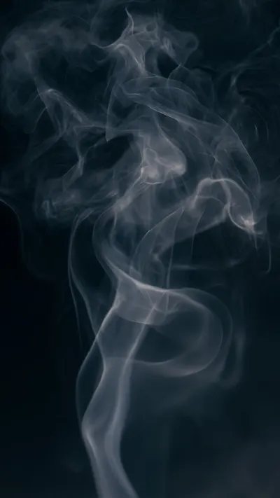 Soft Smoke Wisps On A Dark Background in a soft palette