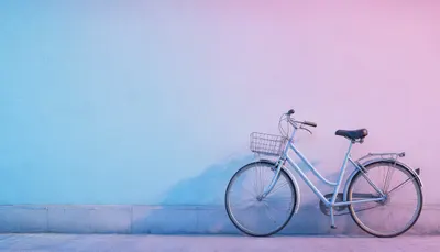 Bicycle Leaning On A Pastel Wall in a cool palette