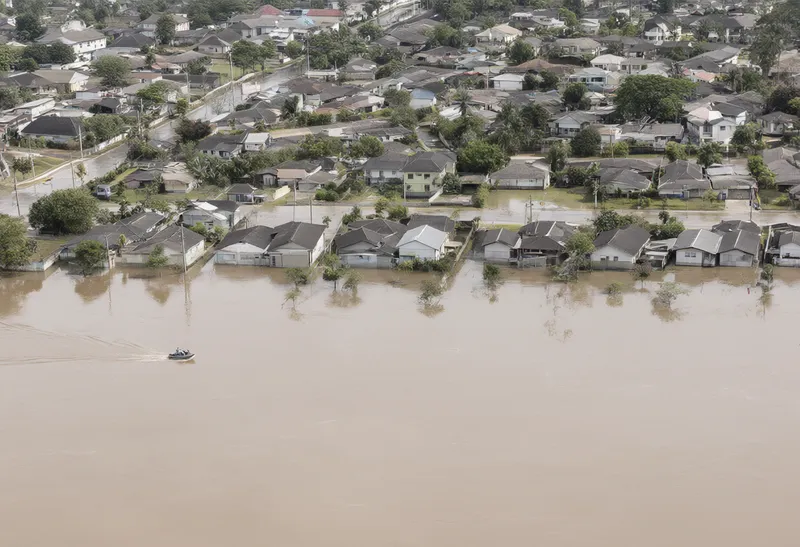 Aerial view of a flooded neighbourhood with only rooftops above the water