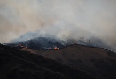 Wildfire on a Hillside at Dusk
