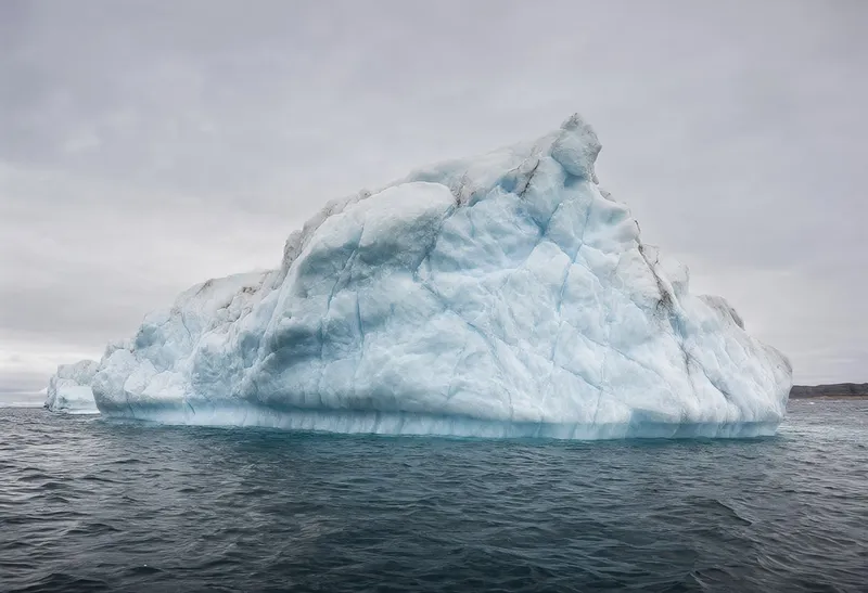Iceberg Floating in Calm Water