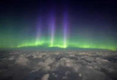 Aurora from Orbit above Clouds