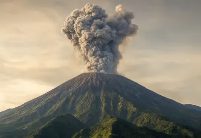 Volcano Erupting with Ash Plume at Dusk