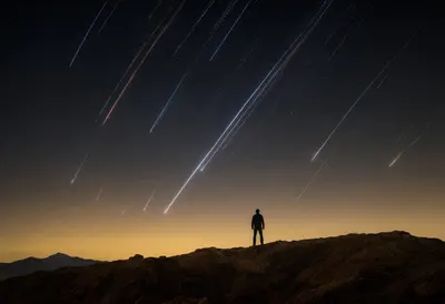Meteor Shower over a Desert Ridge at Dusk