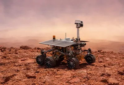 Mars Rover on Red Terrain at Dusk