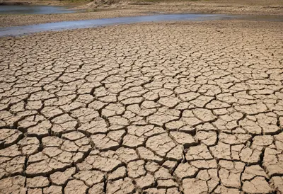 Cracked Reservoir Bed under Hard Sun