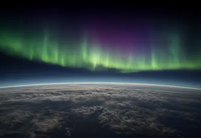 Aurora Seen from Orbit above Clouds