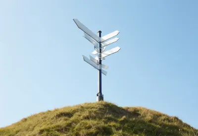Signpost With Blank Arrows On A Hilltop from above Digital Illustration