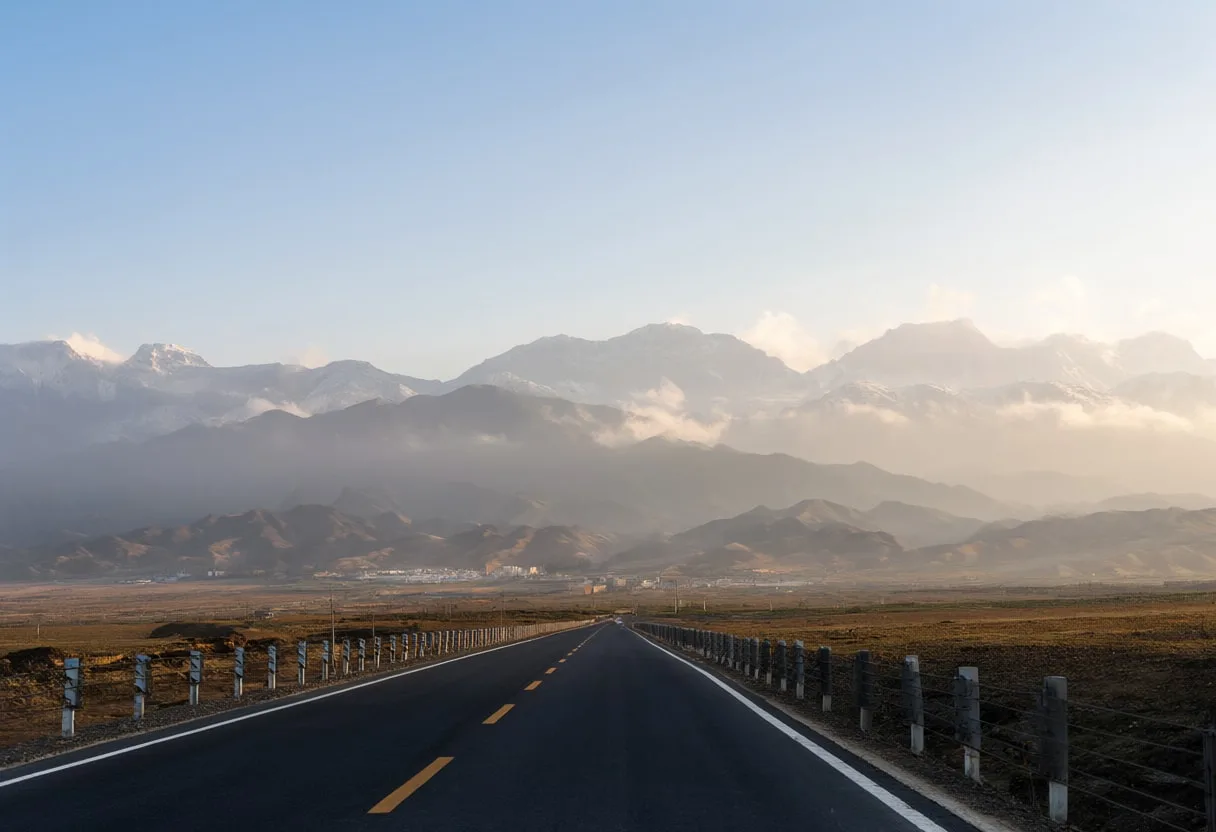 Long Straight Road Toward Distant Mountains at sunrise