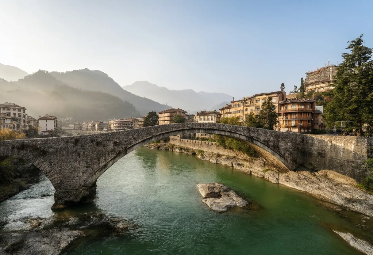 Old Stone Bridge Over A Green River at sunrise