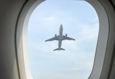 Airport Window With An Airplane Silhouette as a flat lay from above