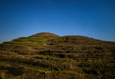 Terraced Hillside Fields under a starry sky