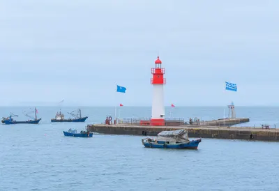 Lighthouse at the Harbour Mouth after rain