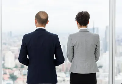 Two Colleagues Seen from Behind