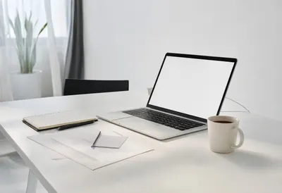 Desk with Laptop and Notebook in a minimal setting