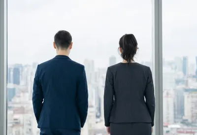Two Colleagues Seen from Behind in a minimal setting