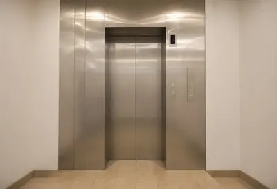 Elevator Lobby in Brushed Metal in a minimal setting