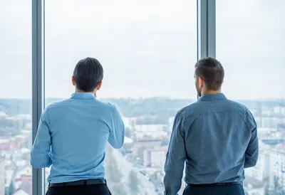 Two Colleagues Seen from Behind with cool clean light