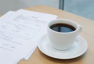Coffee and Printed Report with cool clean light