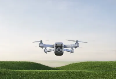 Drone Hovering above a Field in a clean studio